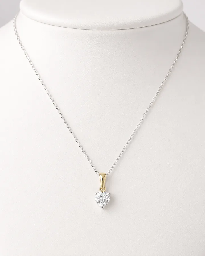 Collana cuore con brillante centrale, oro bianco e giallo